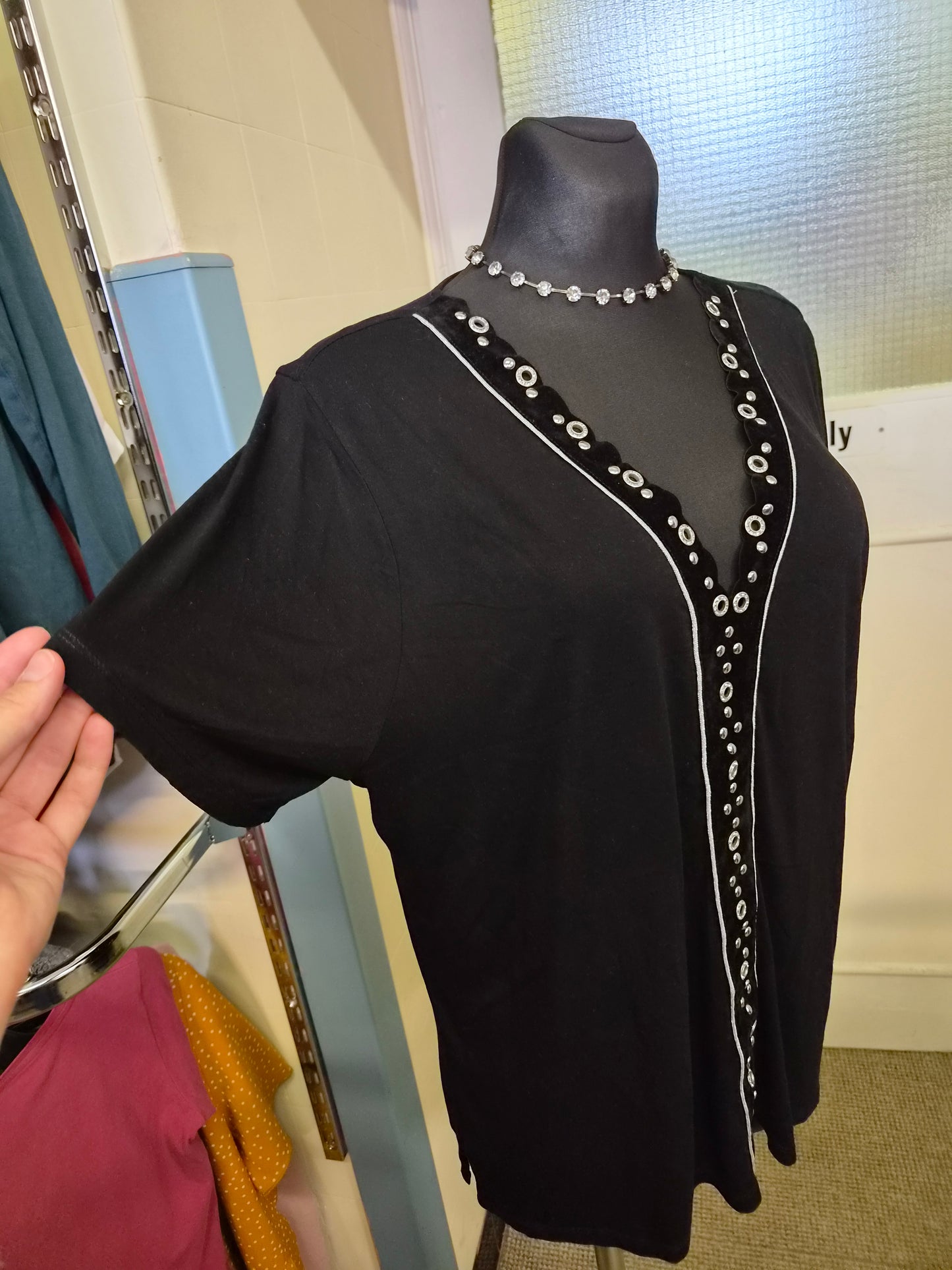 River Island black top, decorative detail in the middle, size 14