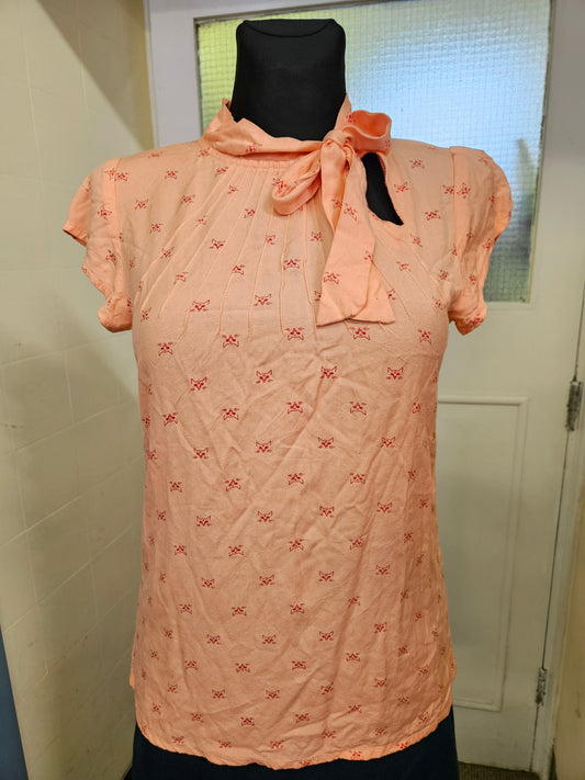 Circus, orange top with cat print, size 10