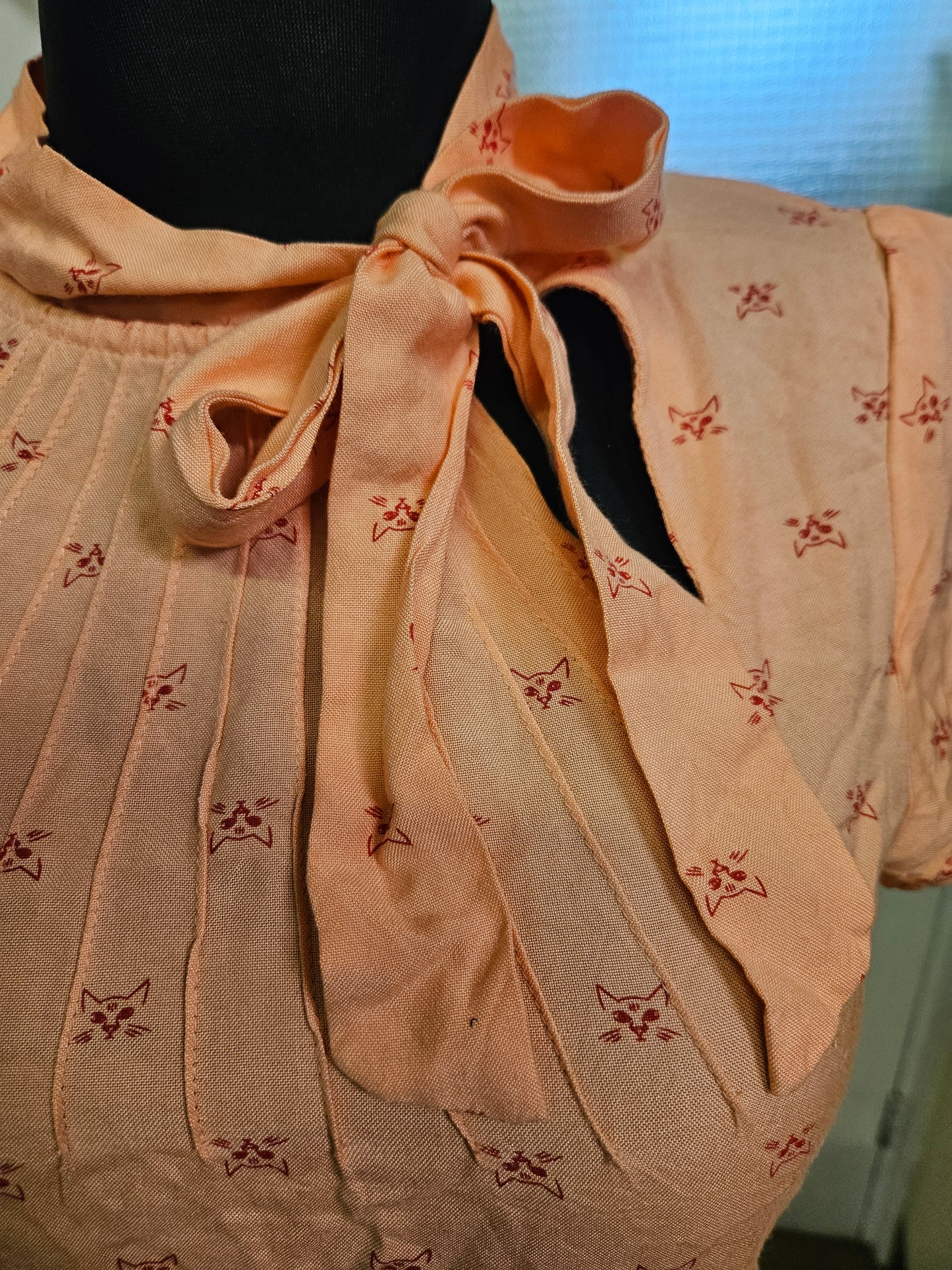 Circus, orange top with cat print, size 10