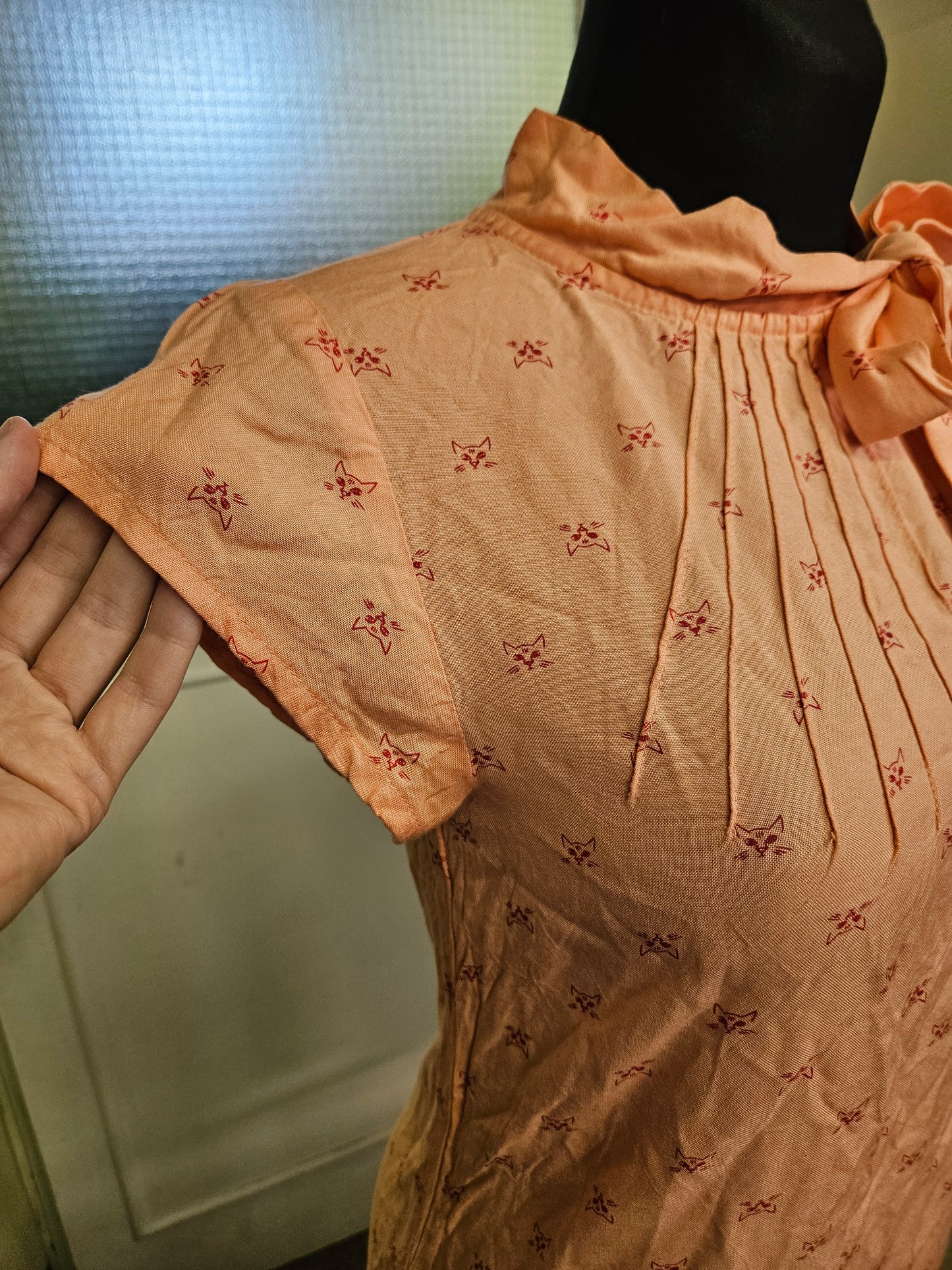 Circus, orange top with cat print, size 10