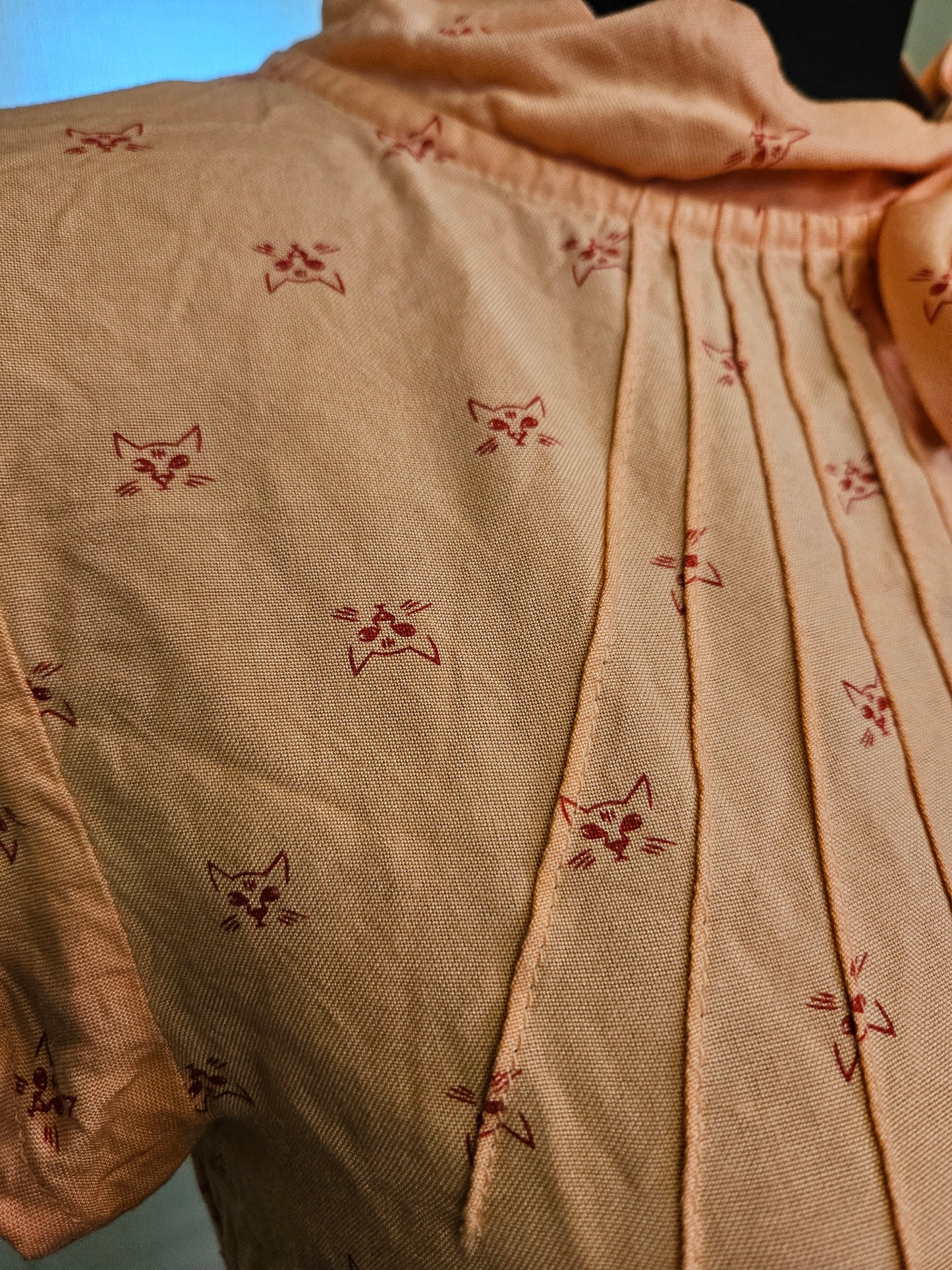 Circus, orange top with cat print, size 10