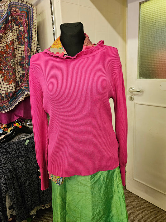 80% viscose,  ribbed knit top with buttons on the sleeves, size M