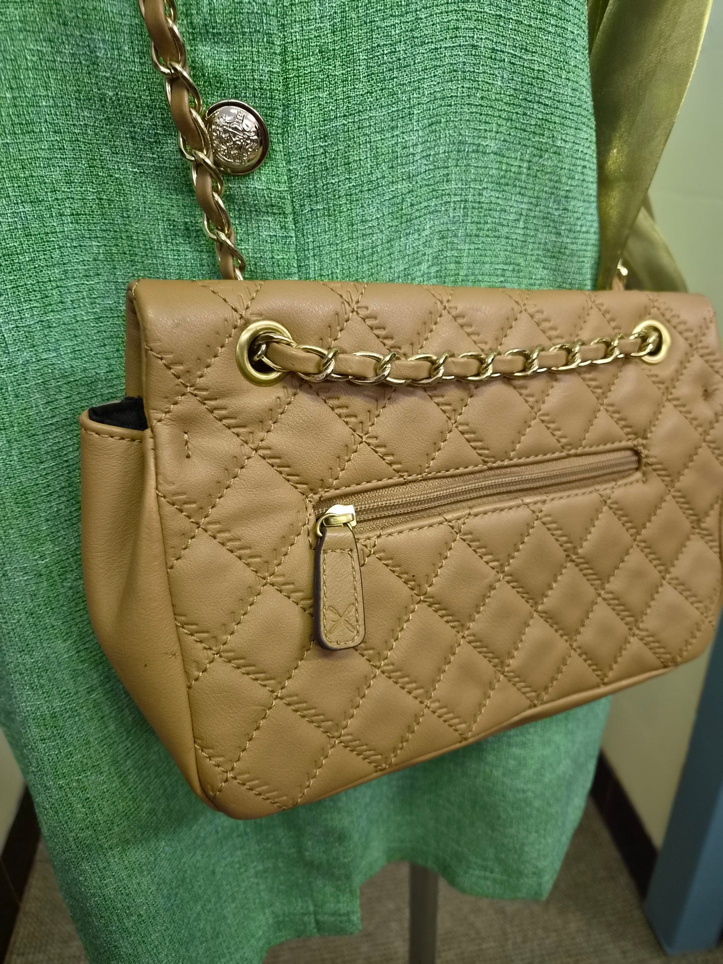 Fiorelli quilted shoulder bag features a distinctive gold clasp and a matching chain strap