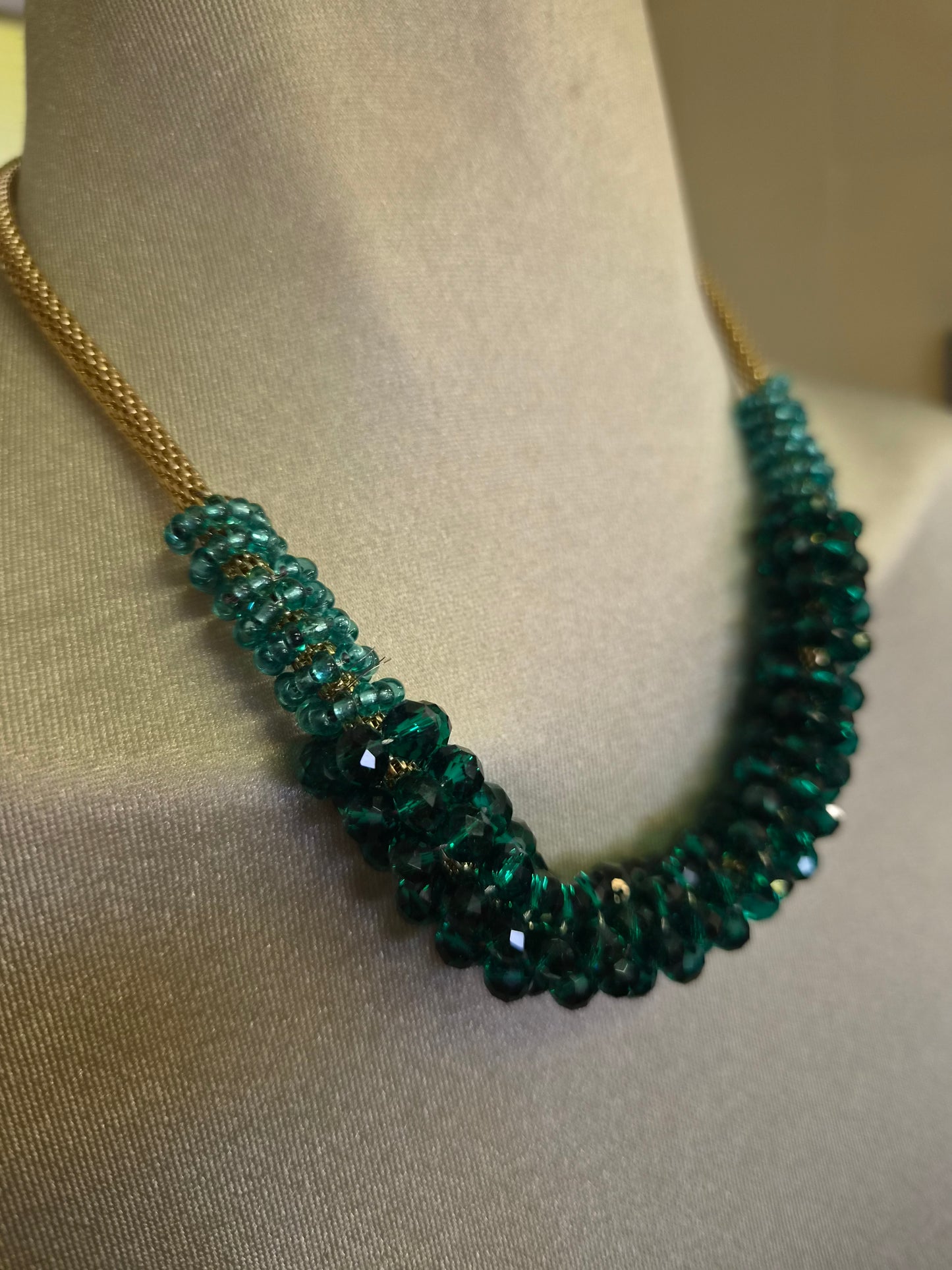 Green beads on a golden chain