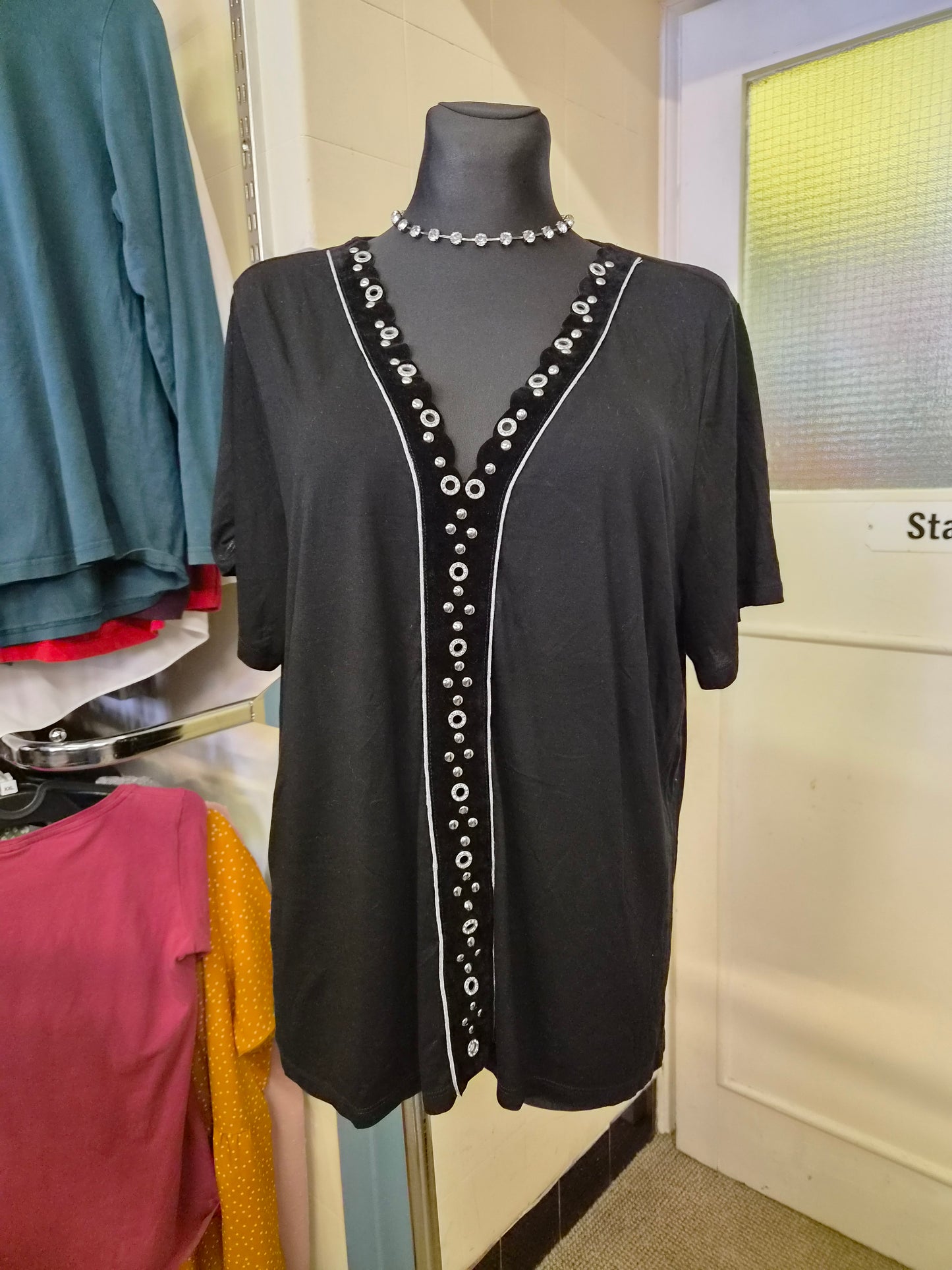 River Island black top, decorative detail in the middle, size 14